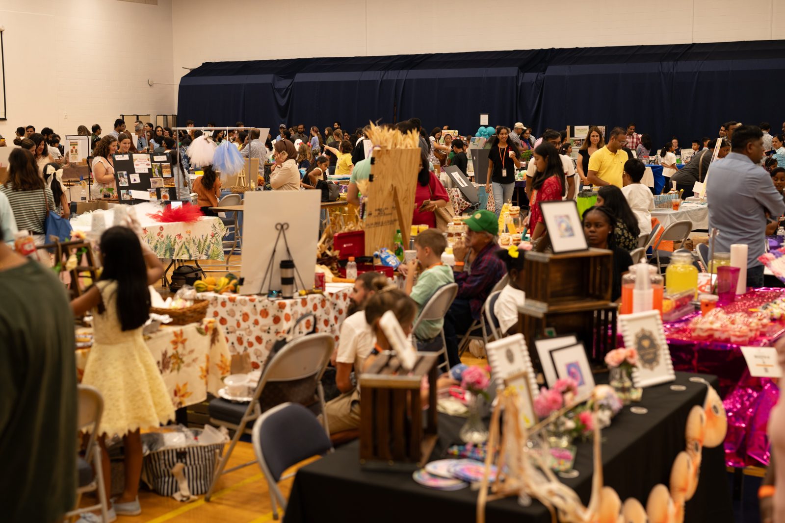 Shoppers browsing kidpreneur booths