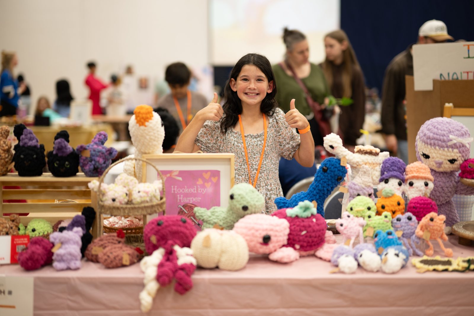 A young founder at her handmade crochet booth
