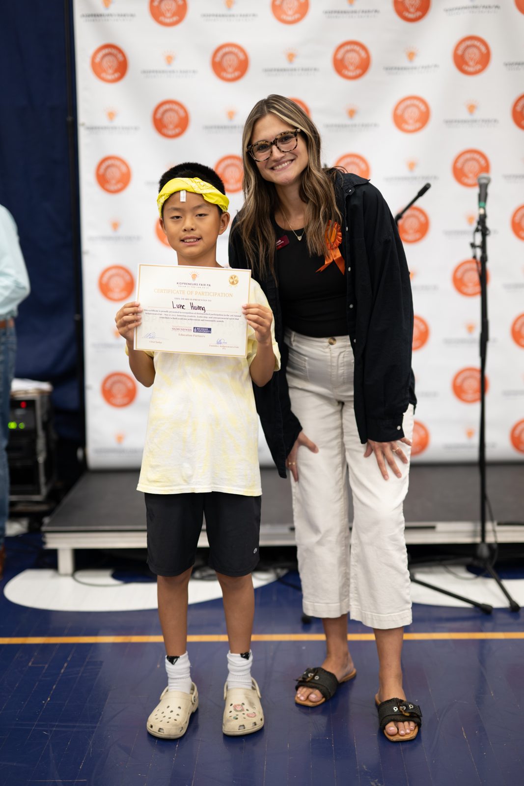 A kidpreneur receiving a certificate of participation