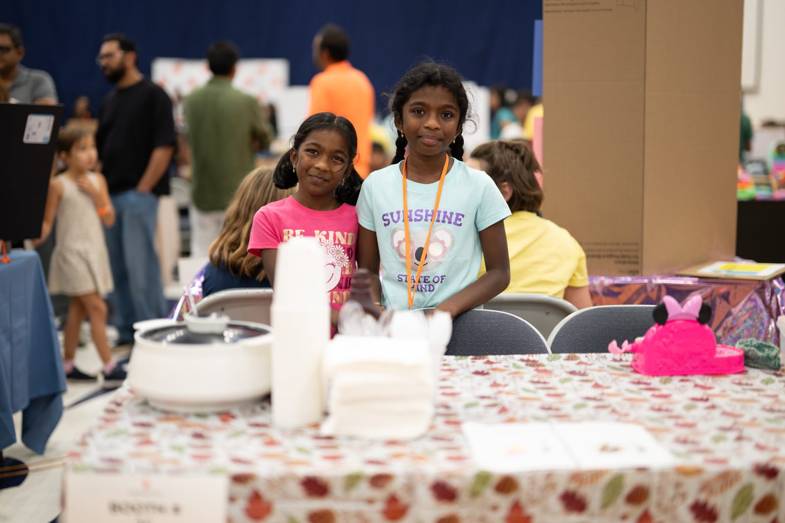 Young kidpreneurs running a food booth
